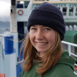 Photo of Jordan Hollarsmith on a boat deck.