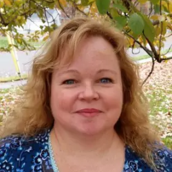 Picture of Karen Greene standing under a tree