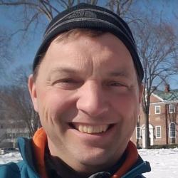 Picture of Bill McDavitt standing outside.