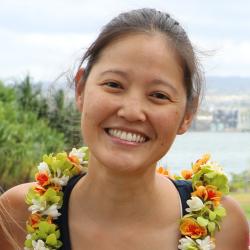 Kym Yano adorned with a lei.