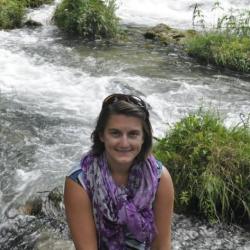 Photo of Michelle Sculley in front of a stream