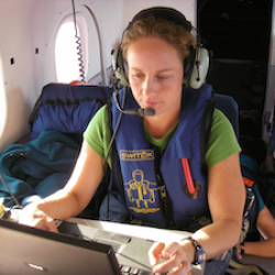 Photograph of Erin LaCasella conducting aerial surveys for leatherback turtles.