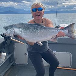 Woman smiling with fish