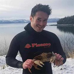 Man smiling with a crab