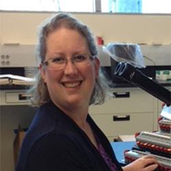 Scientist smiling with microscope