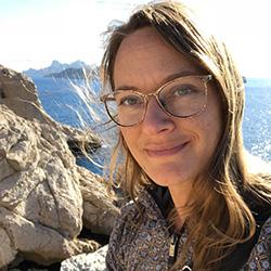 Woman with glasses smiling 