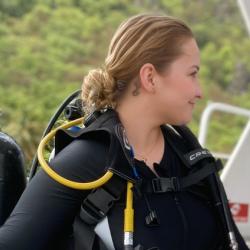 Megan Amico in scubas gear aboard small boat