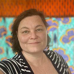Portrait of brunette scientist with a black and white striped shirt