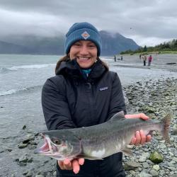 Chloe Moore holding a salmon.
