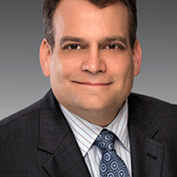 Chad Millen wearing a suit and tie