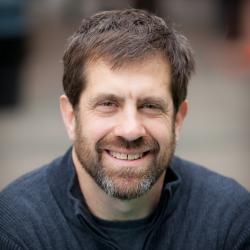 Brunette man with blue sweater 