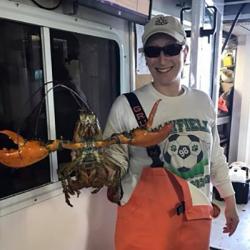 Corey Endres holding a lobster.