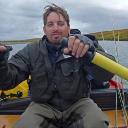 Jason Gasper rowing a boat