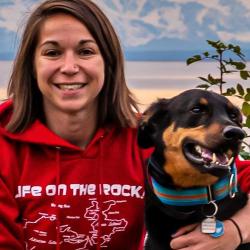Jenna Malek with her dog and mountains in the background