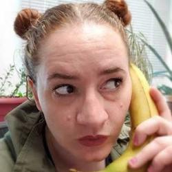 Jessica Patton holding a banana as if it were a telephone