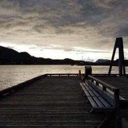 dock with mountains across the water
