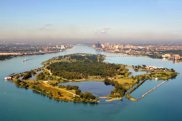 Aerial view of a large forested island in the middle of a river