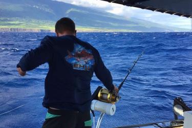 A cooperative research fisher conducts hook-and-line sampling operations in the Alenuihaha channel between Maui and Hawaii island.