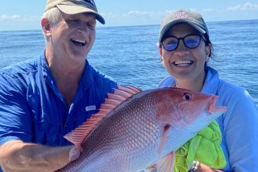 Rec anglers holding red snapper