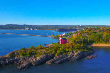 View of coast with red lighthouse