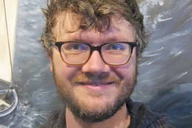 Portrait of scientist with glasses smiling 