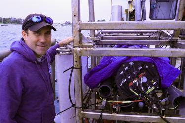 Pete Chase standing next to the HabCam deployment setup.