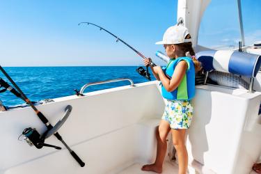 girl-fishing-from-boat