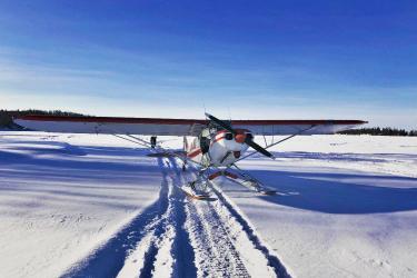 Plane on snowy landscape