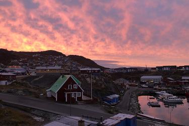 Sunrise over a small town in Greenland.
