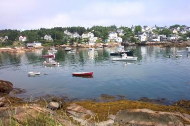Stongington Harbor, Maine, fishing and pleasure vessels in foreground, Stonington buildings in background.