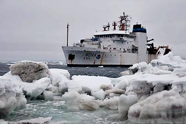 Ship on water with ice in the foreground