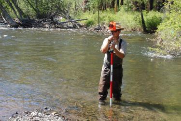 CHaMP crew member learns to collect surveys that provide information on things such as stream structure and terrain elevations.