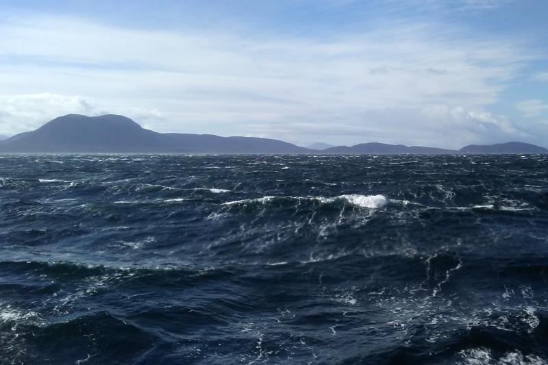 Photo of white capped waves off the coast of Alaska.