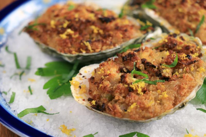 Photo of baked oysters on the half shell. 