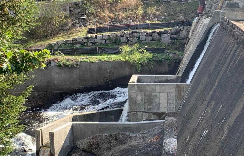 Concrete plunge pool at base of dam