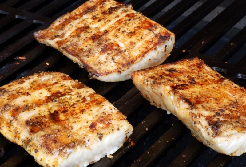 Mahi mahi filets on a grill. 