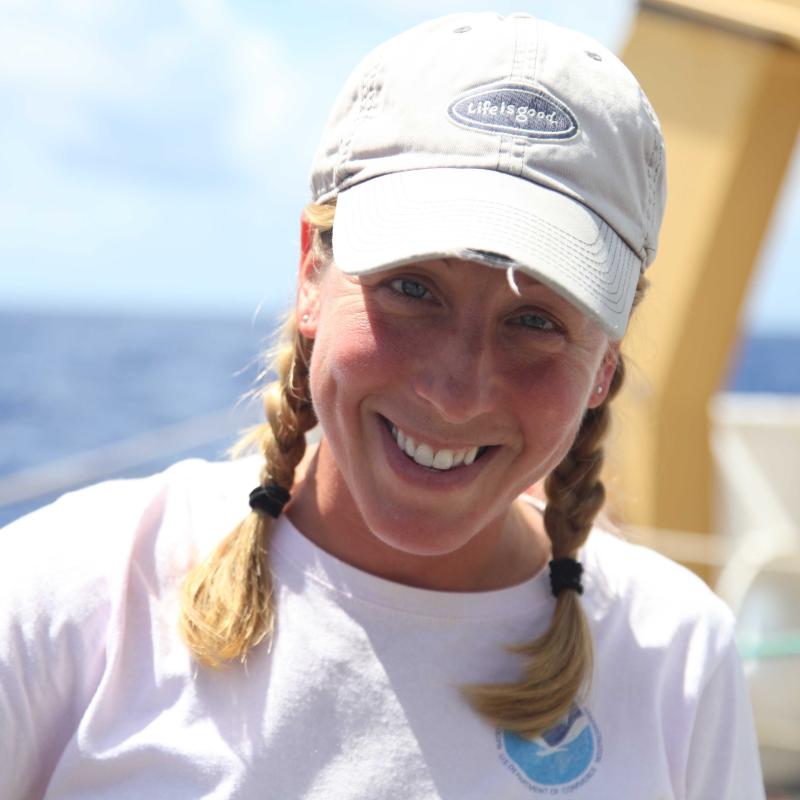 Amanda Bradford smiling aboard the NOAA Oscar Elton Sette.