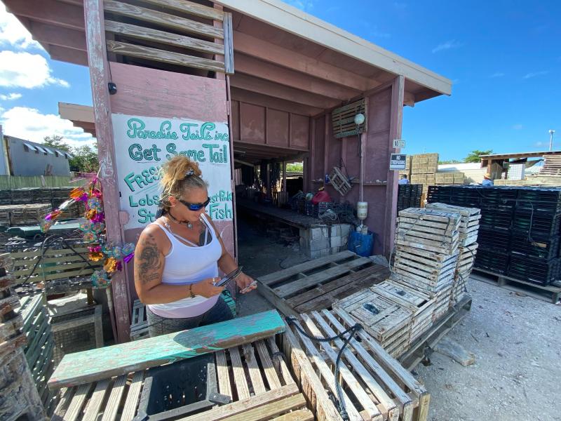 Woman standing in front of fish market