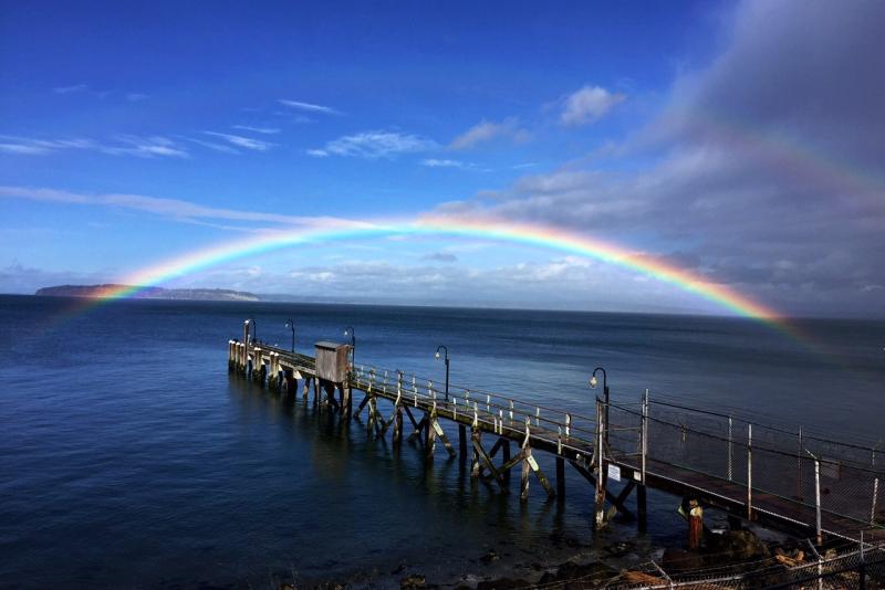 Rainbow over Mukilteo Field Station on the waterfront of Puget Sound in Mukilteo, Washington
