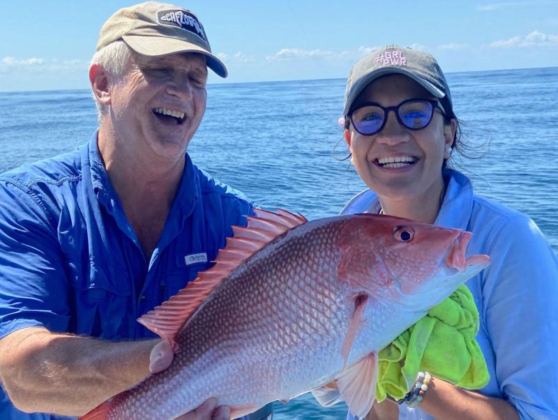 Rec anglers holding red snapper