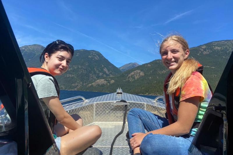 People aboard a boat smiling at the camera