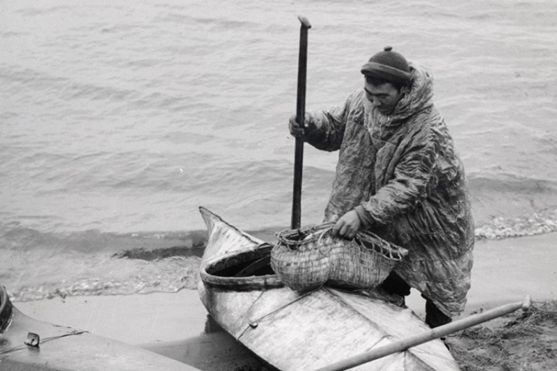 Native American Eskimo and kayak