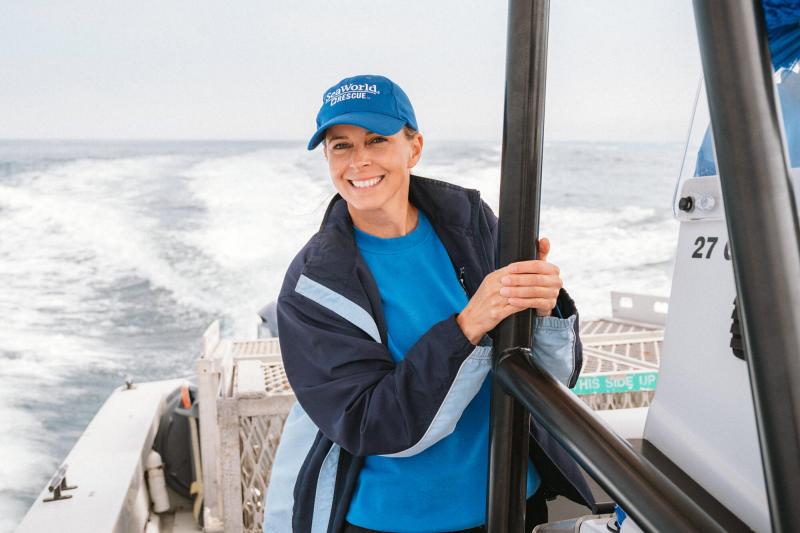 Jeni Smith aboard a vessel smiling at the camera