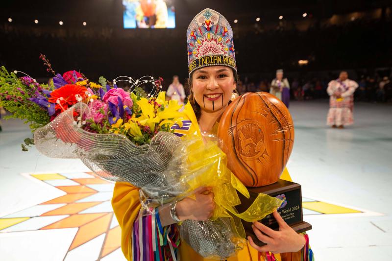 Tori McConnell in traditional dress smiling for the camera