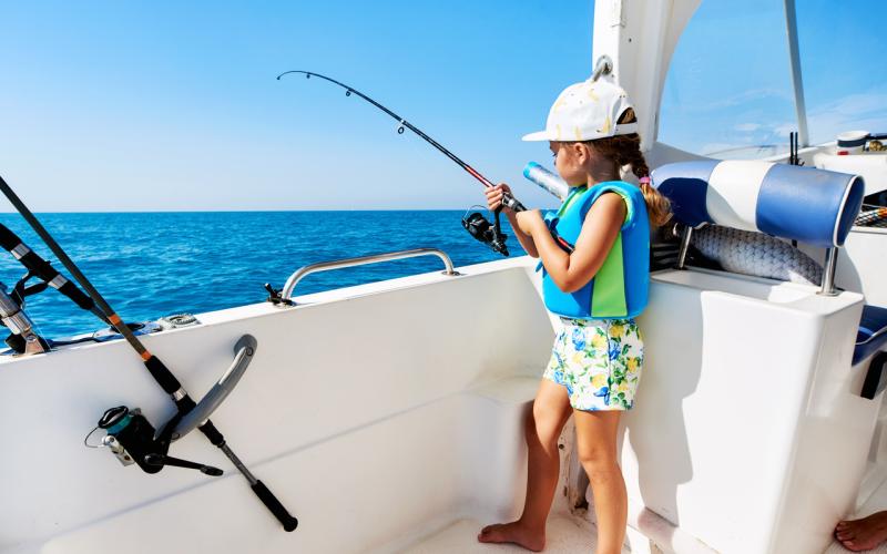 girl-fishing-from-boat