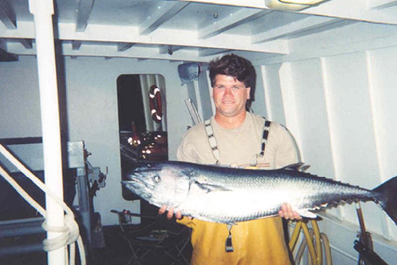 750x500-PI-observer-holding-butterfly-king-fish-NOAA-PIRO.jpg