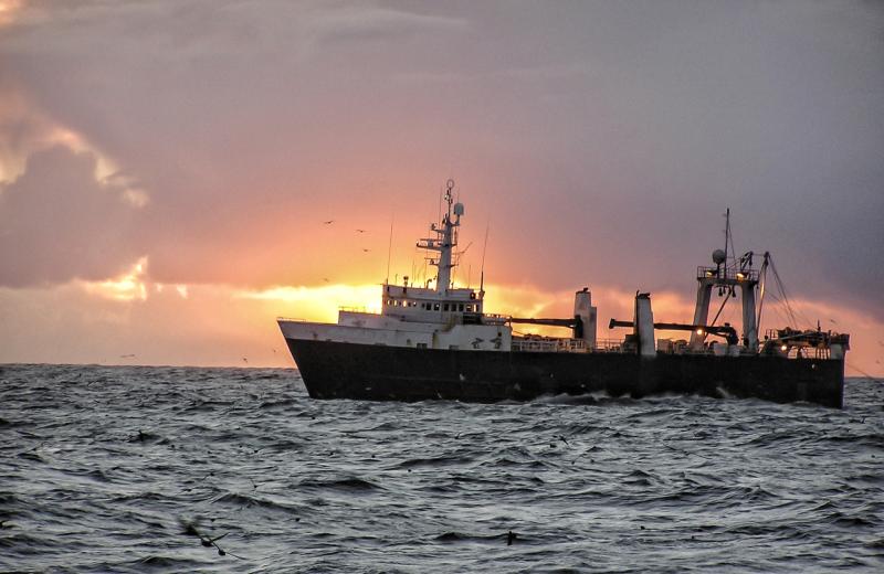 Ship at water during sunset