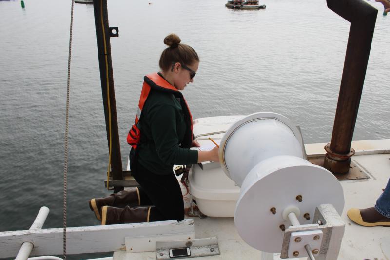 Female observer performing pre-trip safety check. 