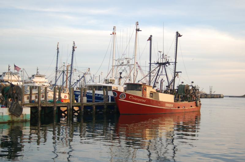 Point Judith dock with various fishing vessels.