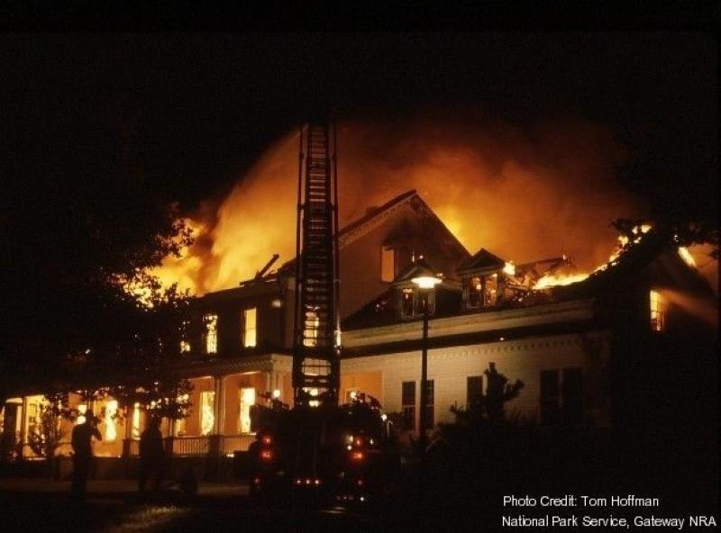 Sandy Hook Lab on fire, ladder truck in front of burning building.